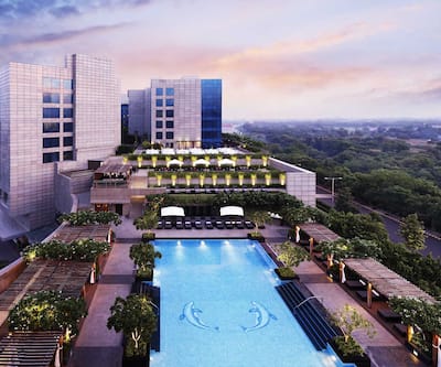 https://imgcld.yatra.com/ytimages/image/upload/t_hotel_yatra_city_desktop/v1430823067/Domestic Hotels/Hotels_Gurgaon/The Leela Ambience Gurgaon Hotel and Residences/exterior_deck_shot.jpg